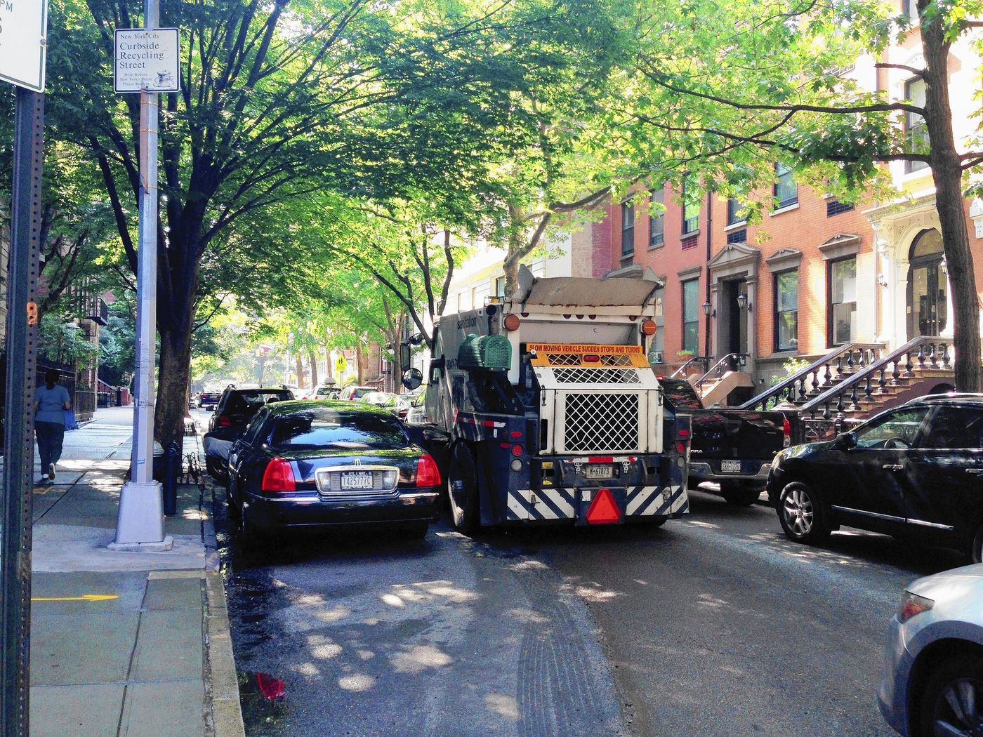 alternate side parking street sweeper sweeping